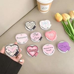 Magnetic heart-shaped Griptok MagSafe phone stand with various cute acrylic patterns