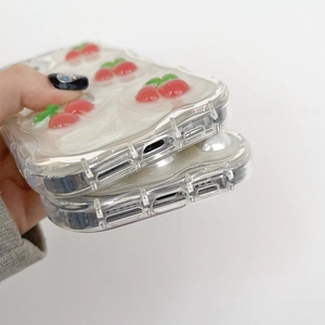 Detail of 3D cream texture and red cherry patterns on clear silicone phone case bottom