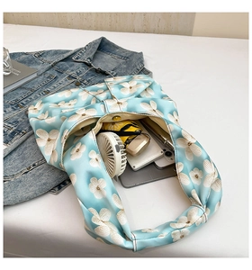 Spacious light blue floral print satin tote bag showcasing large storage capacity