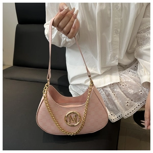 Detailed close-up of pink hobo bag with golden M logo and metallic chain handle