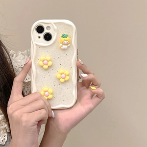 Detail of glitter cream phone case with 3D yellow flowers and pineapple character