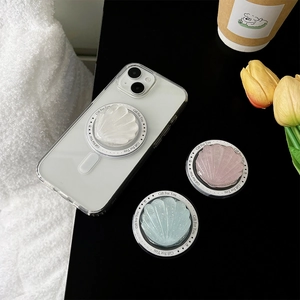 Gros plan de supports magnétiques pour téléphone en forme de coquillage pailleté multicolore