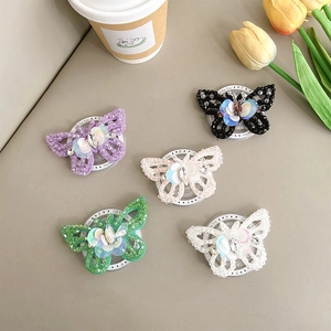 Five-piece beaded butterfly phone grip set in assorted colors with floral lifestyle decor