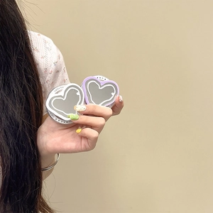Minimalist heart-shaped Magsafe mirror phone grip with gift text in white and lilac colors