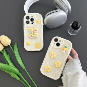 Glitter wavy iPhone case featuring cute 3D donuts, bears and flower charms in cream tones