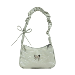 Light green pleated underarm bag with silver bow buckle and wrinkled leather texture