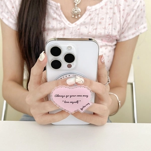 Pink heart MagSafe phone grip holder with Always go your own way text on white phone
