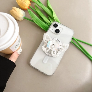 Detailed view of rhinestone butterfly phone grip on clear case with beaded accents