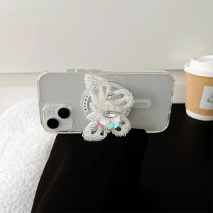 Detail of beaded butterfly phone grip with sparkling rhinestones on a clear case
