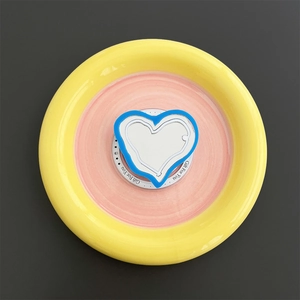 Close-up of heart-shaped magnetic MagSafe phone grip with built-in makeup mirror