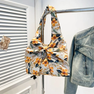 Floral shoulder tote bag with a large bow and yellow flower pattern for women