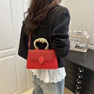 Elegant red square handbag with a unique gold sculptural metal handle for women