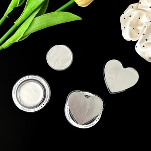 Sparkly glitter phone grip set with round and heart shapes on a black gift background