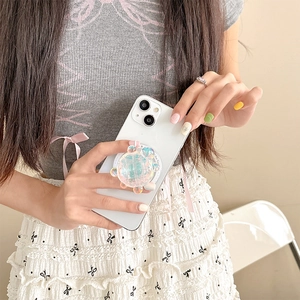 Close-up of a laser holographic bear phone grip showing colorful resin texture