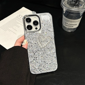 Sparkly silver glitter phone case for iPhone with pearl heart design and bow accents