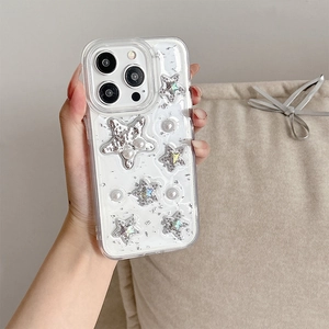 Close-up of sparkling iPhone case with silver 3D stars and inlaid pearls detail