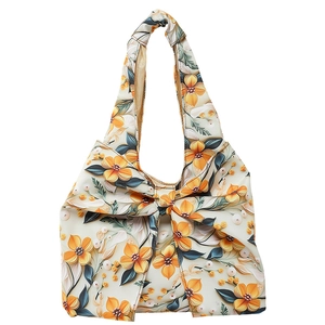 Floral print cotton tote bag with large yellow flowers and oversized bow detail
