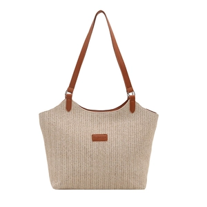 Beige woven tote bag with brown leather straps and fashion patch for summer 2025