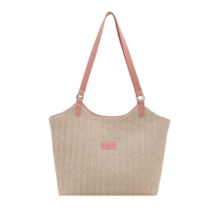 Woven straw tote bag with pink leather trim and fashion label, minimalist summer style