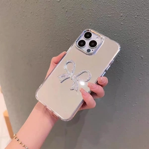 Coque iPhone miroir transparente de luxe ornée d'un nœud en strass pour un look chic