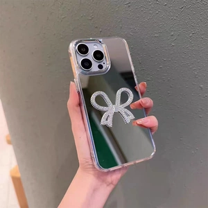 Coque de téléphone miroir pour iPhone avec un nœud en strass argenté et surface réfléchissante
