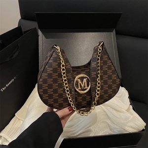 Brown monogram crescent shoulder bag with gold M logo and chain in a premium gift box