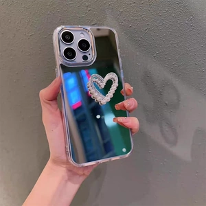 Coque miroir pour iPhone avec cœur en strass et nœud en perles élégant