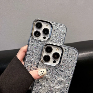 Detailed view of silver glitter iPhone case with sparkling bow and mirror edges