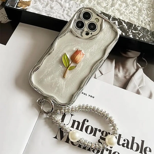 Tulip iPhone case with pearl wrist strap, 3D floral design, and silver plating edges