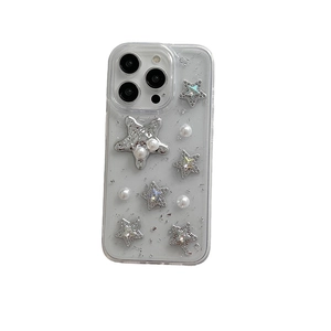 Sparkly iPhone case with silver stars, pearls, and glitter foil on a transparent cover