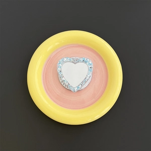 Detail of heart-shaped MagSafe phone holder with glitter sequins and mirror function