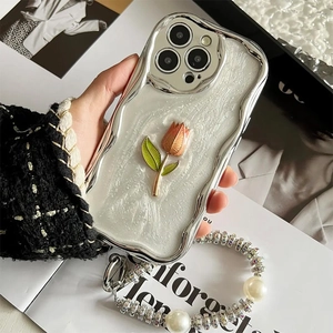 Detailed view of silver tulip phone case with luxurious pearl and rhinestone strap