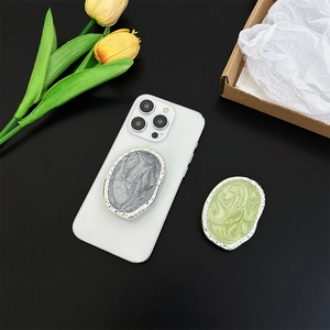 Silver marble phone socket grip with silver frame on smartphone, life scene setup
