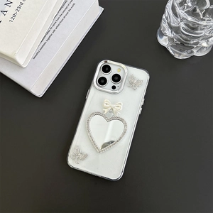 Sparkly butterfly iPhone case with rhinestones, heart mirror, and elegant white bow decoration
