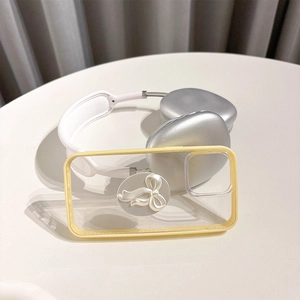 Detail of a phone case featuring a 3D white bow and cream yellow vibrant side frames