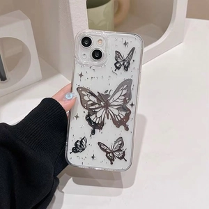 Detailed view of clear iPhone case featuring silver butterfly patterns with glitter