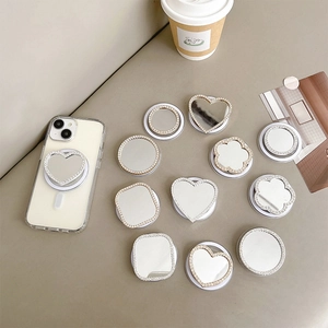 Rhinestone heart mirror phone grip stand showing multiple shapes on a white iPhone