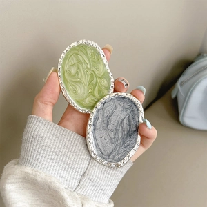 Close-up of marble texture phone sockets with silver irregular metallic edges