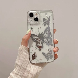 Macro view of clear iPhone case featuring silver metallic butterflies and glitter sparkles