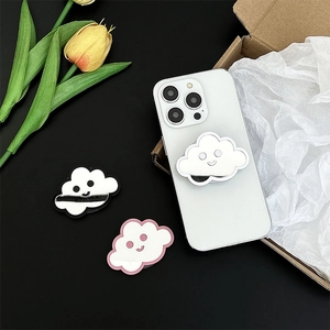 Detailed view of cute cloud-shaped mirrored phone grip stand on a white smartphone