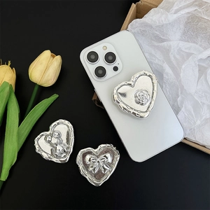 Silver heart-shaped adhesive phone grip with elegant rose, bow, and bear relief details