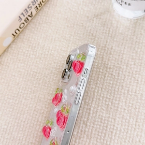 Detail view of transparent phone case with 3D rose decor and metallic side frame