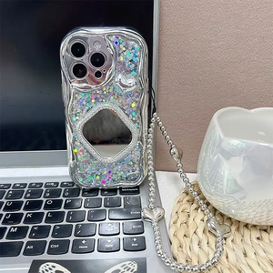 Detailed view of sparkly glitter iPhone case with square mirror and heart bead strap.