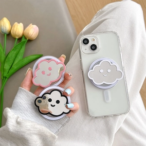 Close-up of cloud-shaped mirror phone grips in pink, black and grey with smiling face