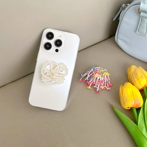 White phone case with pearl flower pop-up stand and colorful bead charms on leather