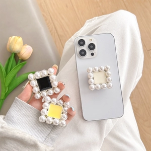 Square pearl trim phone grip and stand in black yellow and cream color options