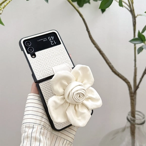 Close-up of cream woven leather phone case with 3D fabric rose for Samsung Galaxy Z Flip