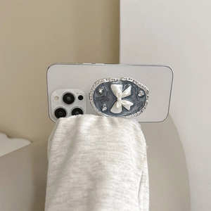 Silver oval phone grip with marble texture, 3D white bow and sparkling rhinestones