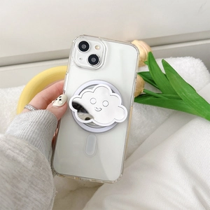 Detail of cloud-shaped mirror phone socket with a smiley face on a clear case