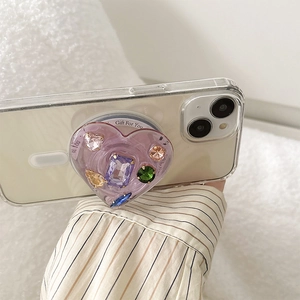 Purple heart-shaped MagSafe phone grip with colorful gemstones and Gift For You text